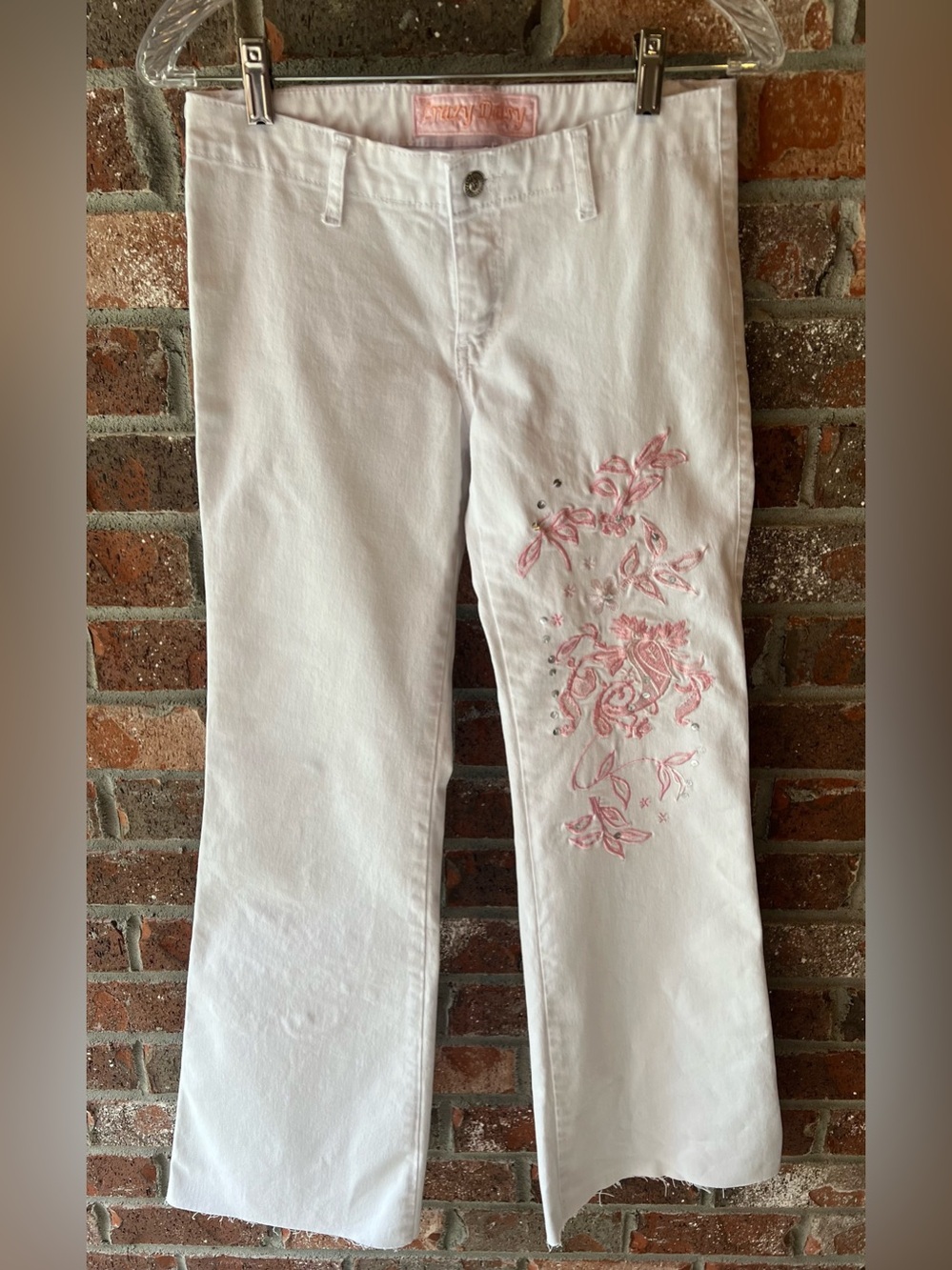 Crazy Daisy vintage pair of white embroidered, low-rise flare jeans size 28.